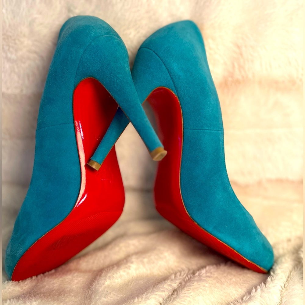 Christian Louboutin blue suede round toe pumps.